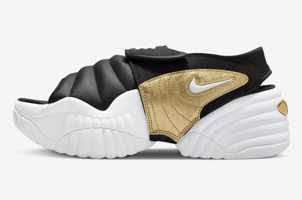 Nike Air Adjust Force黑色、白色和金属金凉鞋表面
